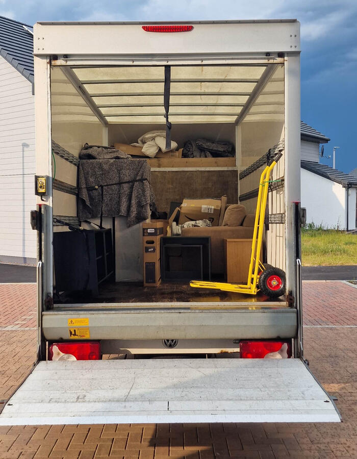 Back of G & D Electrical Services Ltd removal van, emphasizing their commitment to thorough and secure moving services in Insch AB52 6HG, serving all of Aberdeenshire with expert logistics support.