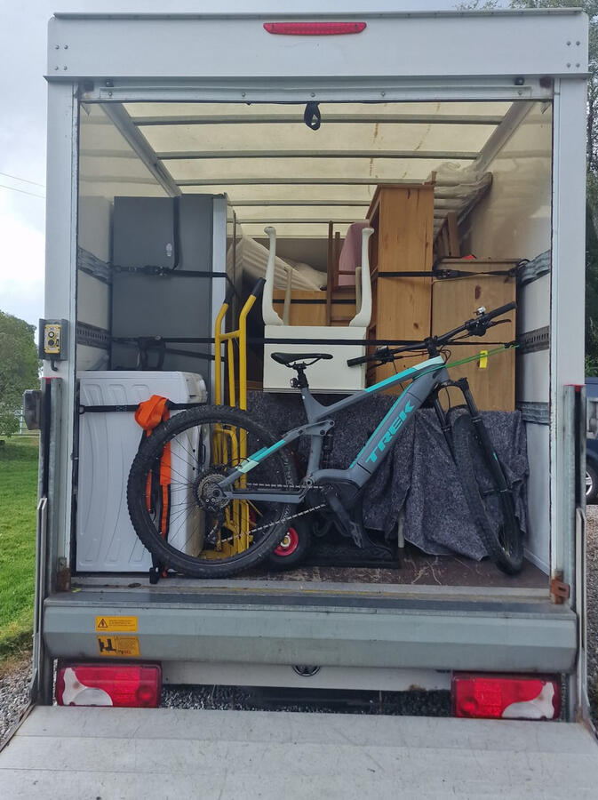 Back of G & D Electrical Services Ltd removal van, focusing on their reliable and organized removal services in Insch AB52 6HG, ensuring effective transport and logistics support throughout Aberdeenshire.